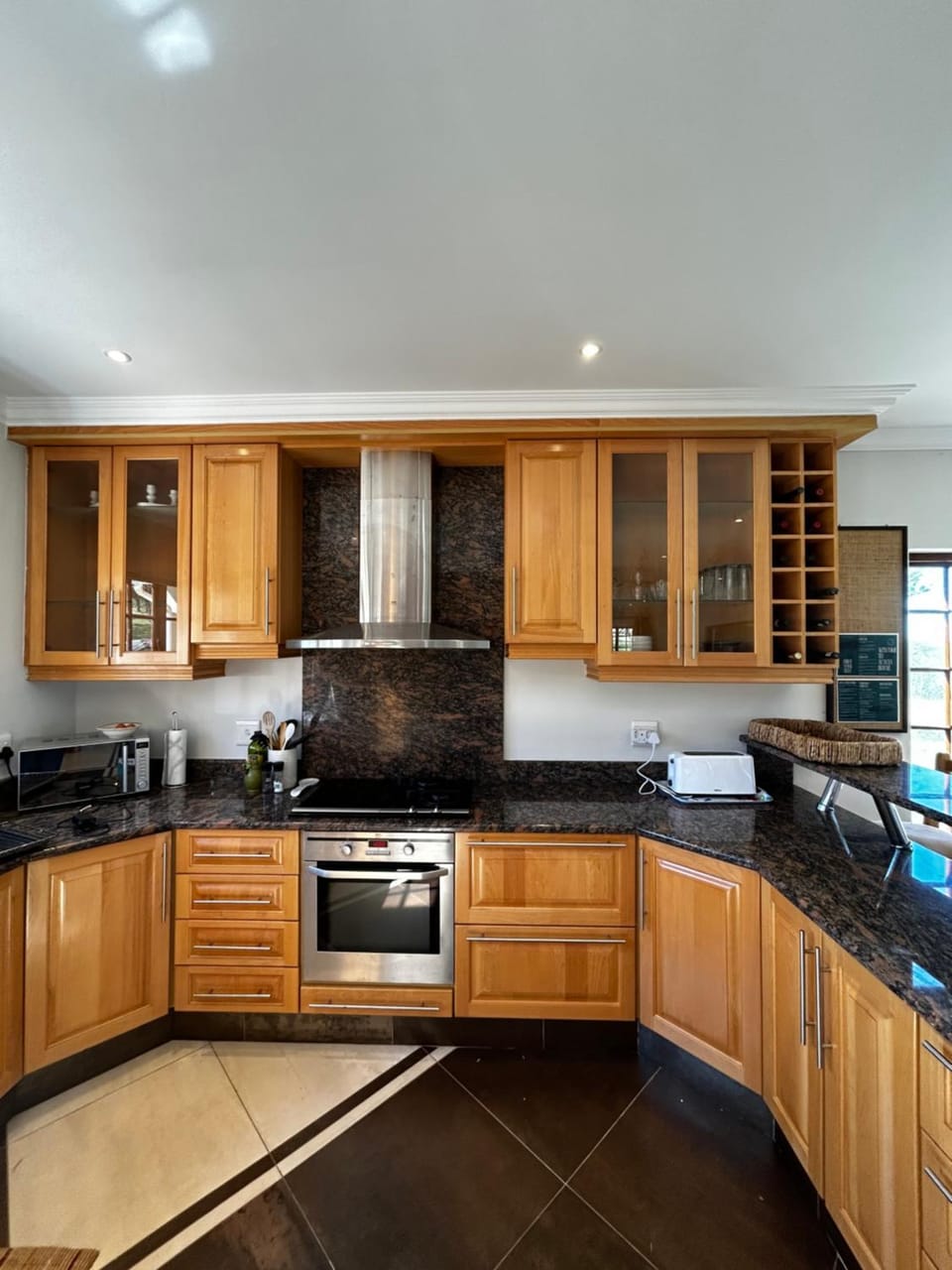 Kitchen or kitchenette, dishwasher, stove, toaster