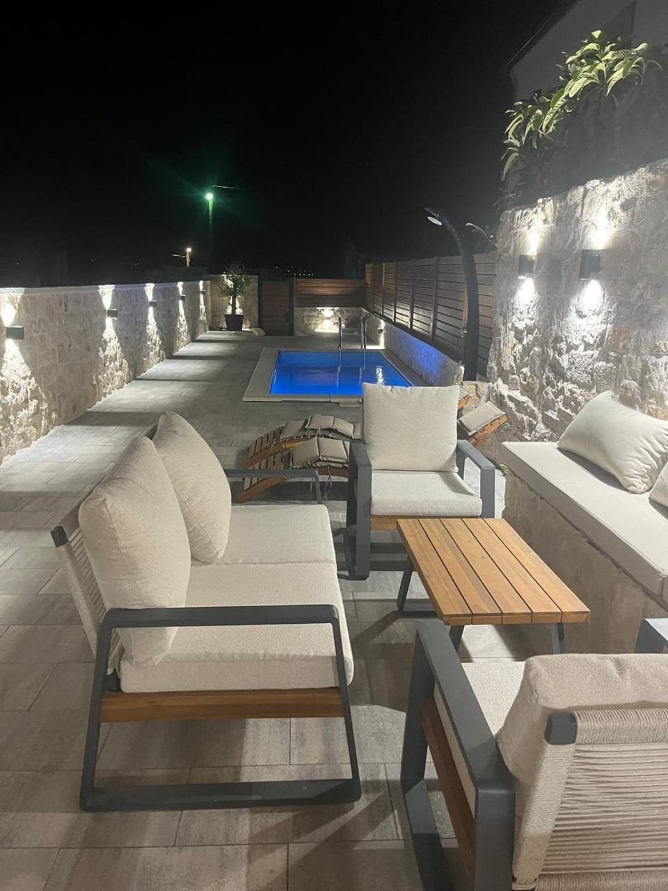 Patio, Night, Natural landscape, Seating area, Pool view, Swimming pool, sunbed