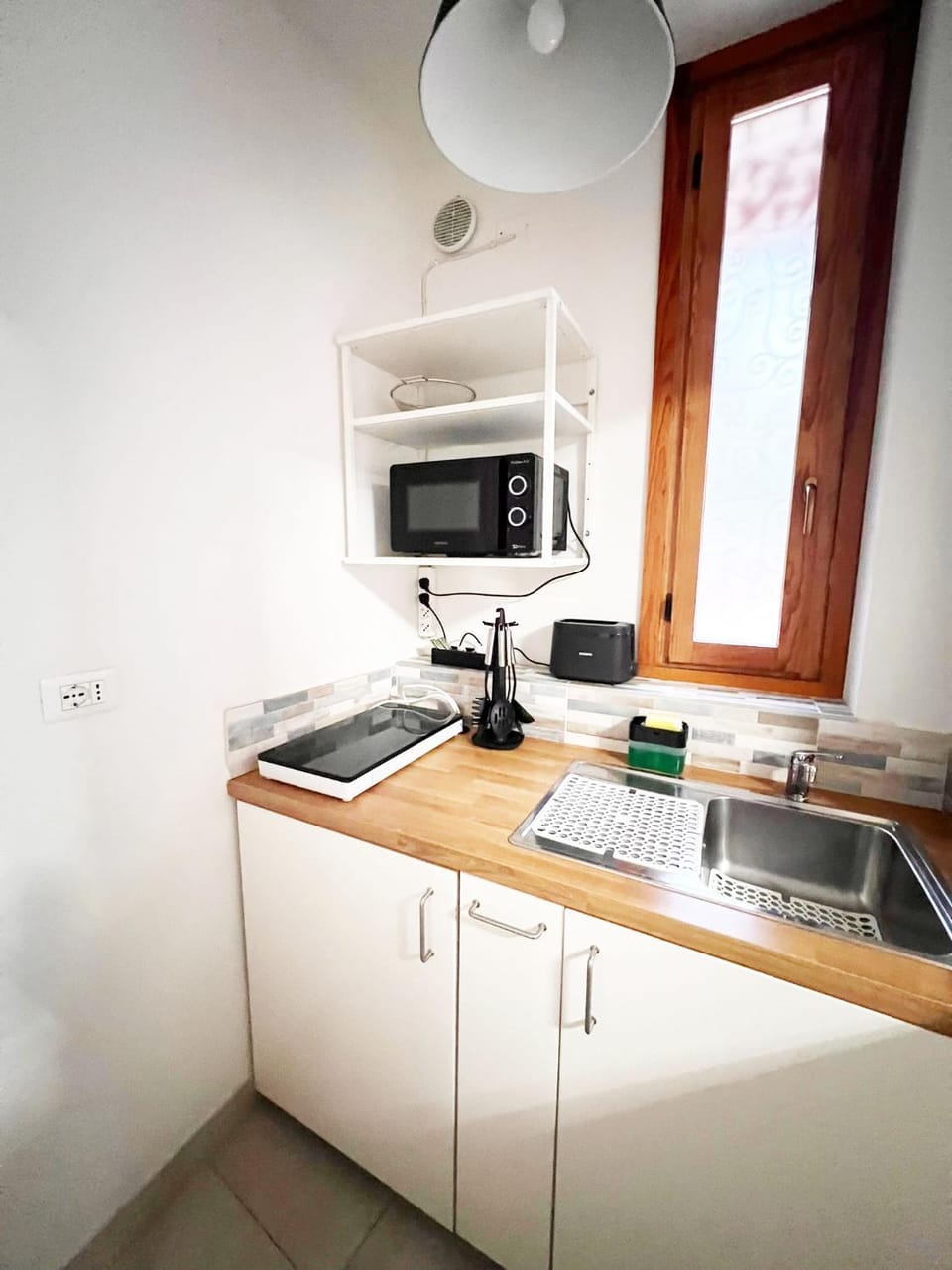 Kitchen or kitchenette, stove, toaster