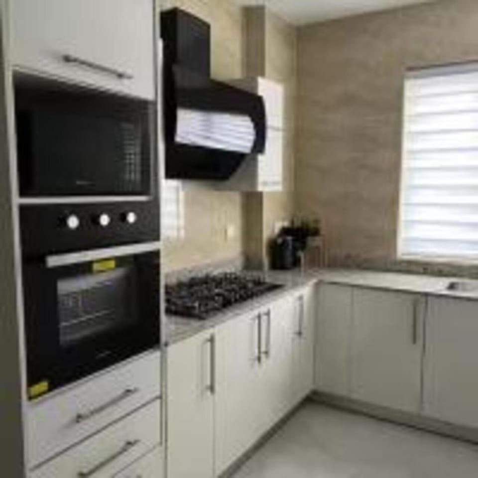 Kitchen or kitchenette, microwave, oven, stove