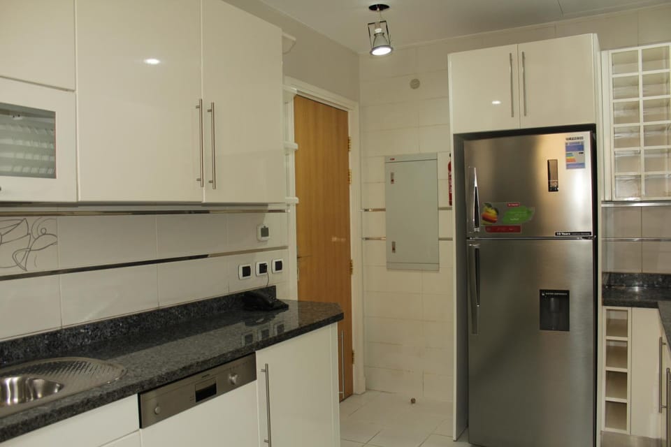 Kitchen or kitchenette, dishwasher, oven, stove