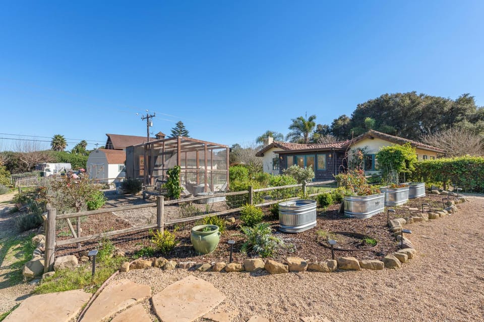 Spanish Farmhouse Retreat | Gardens + Fireplace House in Goleta