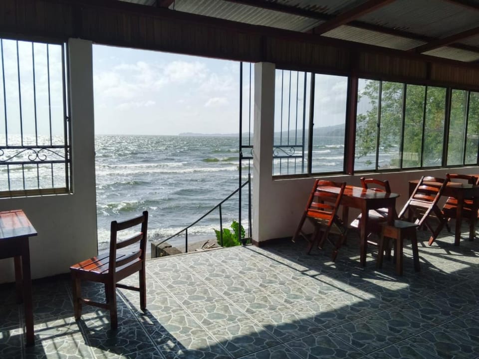 Property building, Natural landscape, Living room, Seating area, Dining area, Lake view, Mountain view