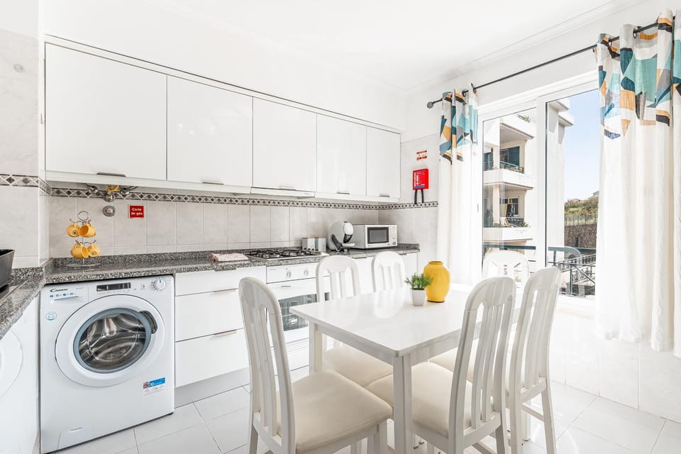 Kitchen or kitchenette, stove, washing machine