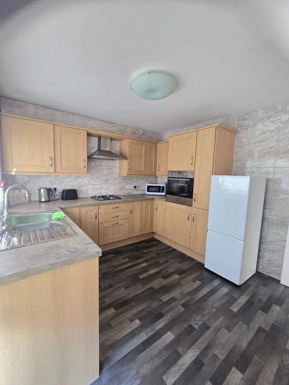 Kitchen or kitchenette, microwave, oven, stove, toaster