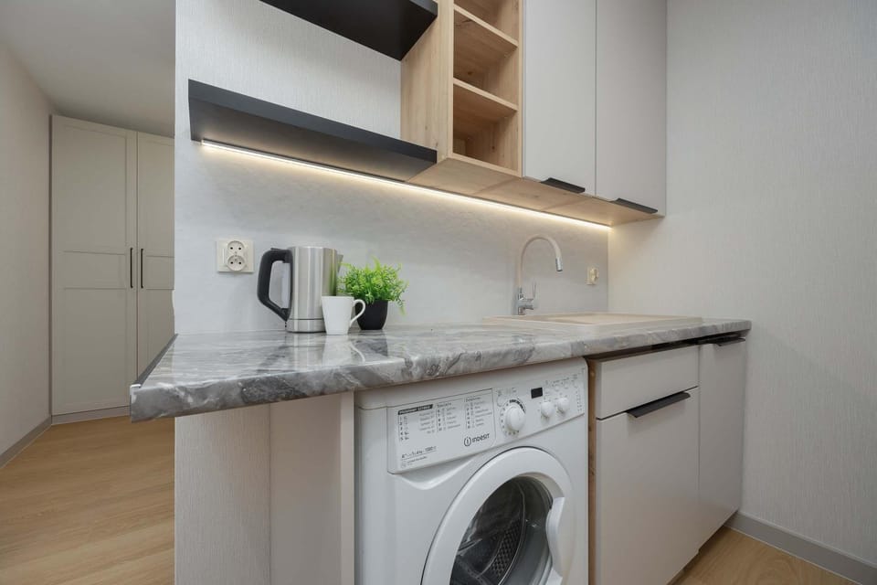 Kitchen or kitchenette, dishwasher, stove, washing machine