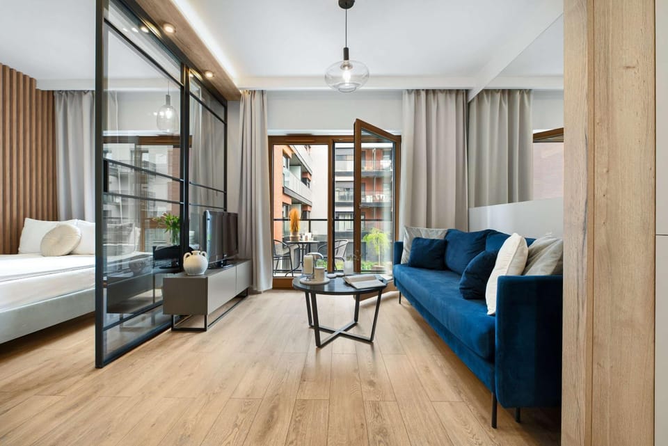 Bed, TV and multimedia, Living room, Seating area, Bedroom