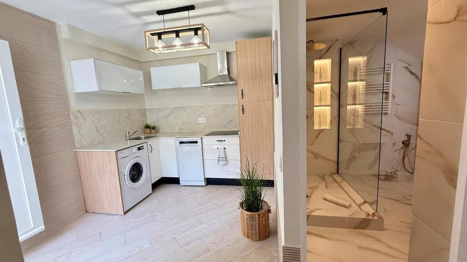 Shower, Bathroom, Kitchen or kitchenette, dishwasher, stove, washing machine