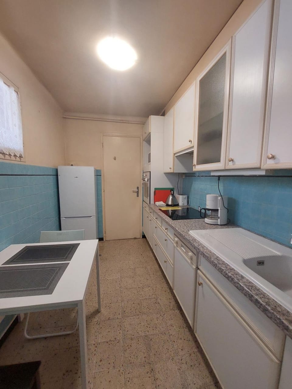 Kitchen or kitchenette, dishwasher, oven, stove, toaster