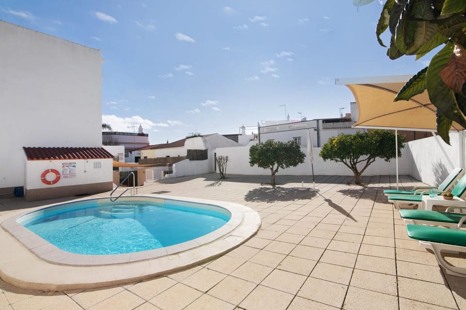 Property building, Living room, Swimming pool