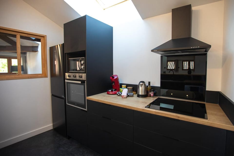 Kitchen or kitchenette, dishwasher, oven, stove