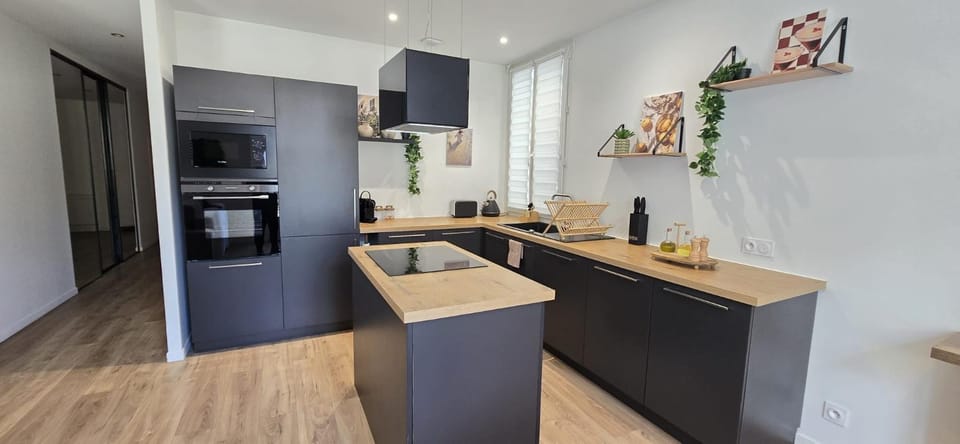 Kitchen or kitchenette, dishwasher, oven, stove, toaster
