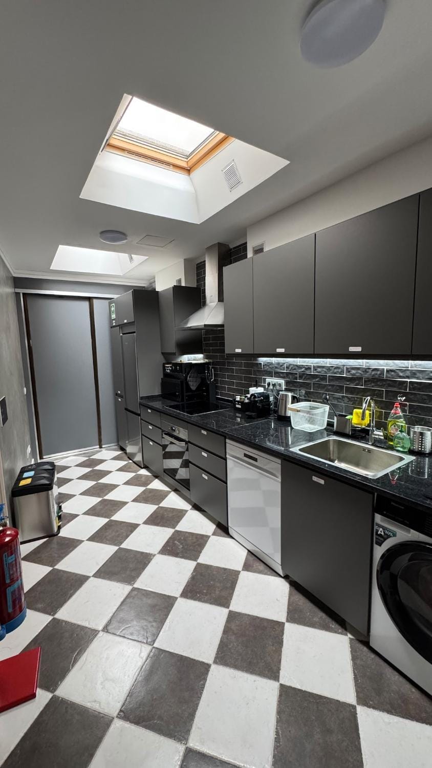Kitchen or kitchenette, dishwasher, oven, stove, washing machine, dryer