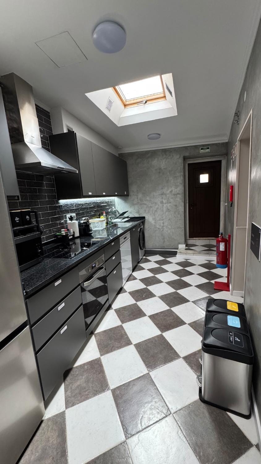 Kitchen or kitchenette, dishwasher, oven, stove