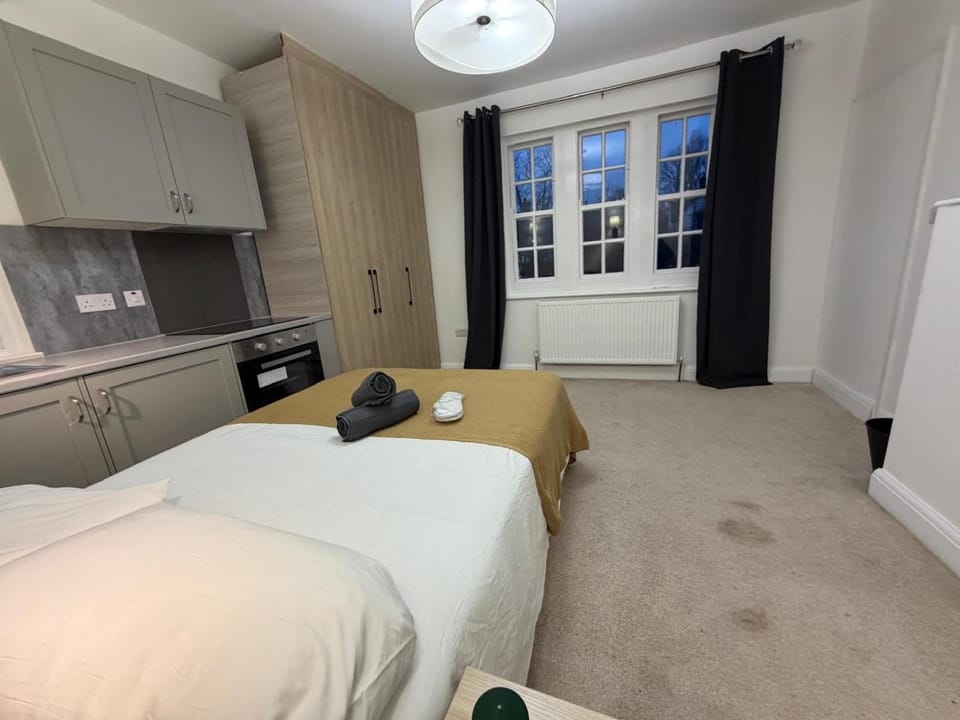Bed, Kitchen or kitchenette, Bedroom, oven, stove, towels