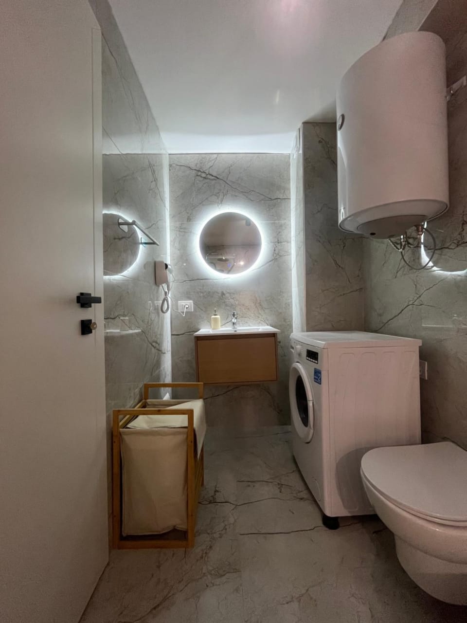 Toilet, towels, washing machine