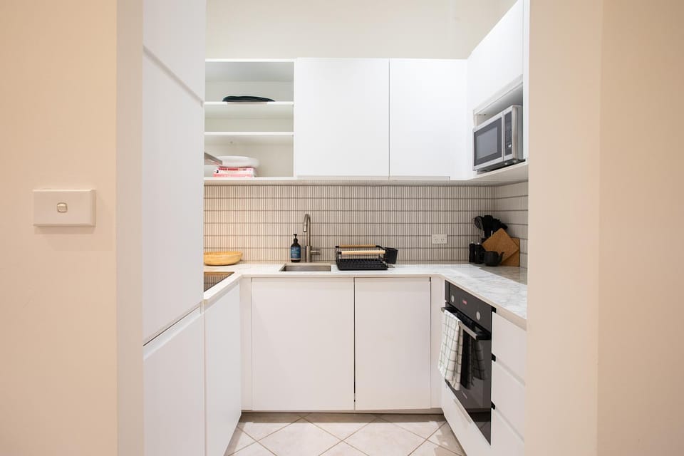 Kitchen or kitchenette, dishwasher, oven, stove, toaster