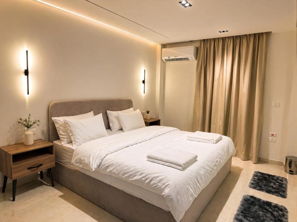 Photo of the whole room, Bedroom, towels, air conditioner