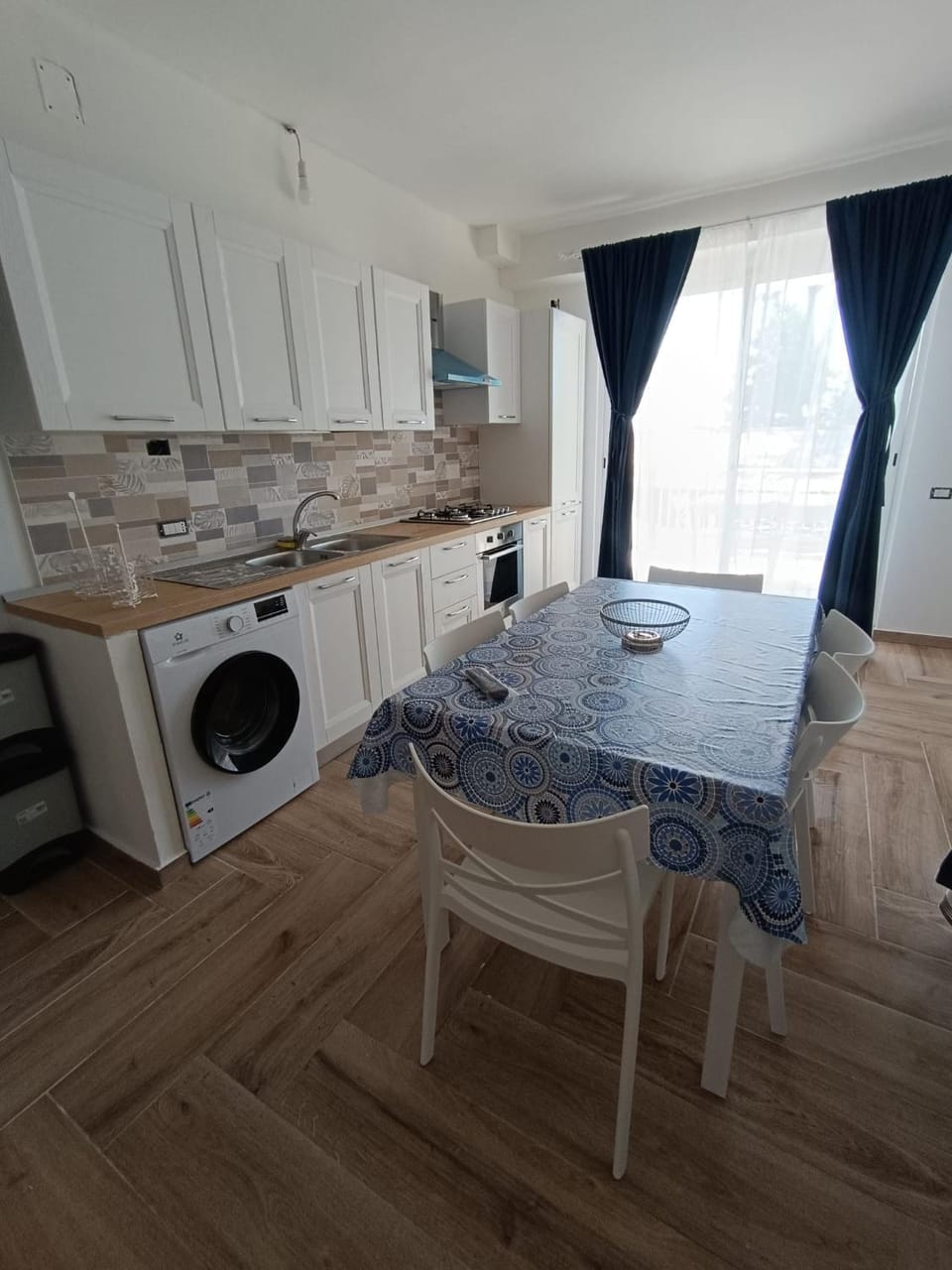 Living room, Seating area, stove, washing machine, kitchen