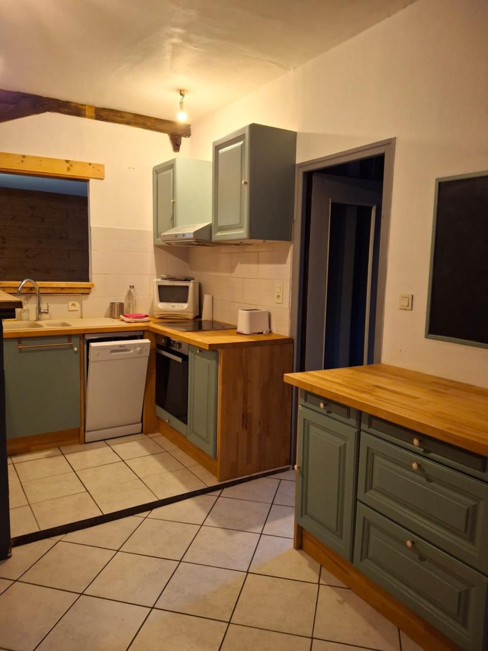 Kitchen or kitchenette, dishwasher, oven, stove