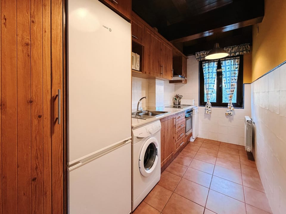 Kitchen or kitchenette, dishwasher, microwave, oven, washing machine