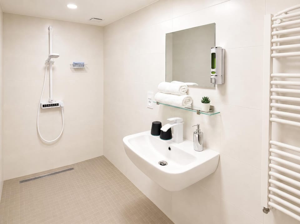 Shower, Toilet, Bathroom, hair dryier, towels, laundry
