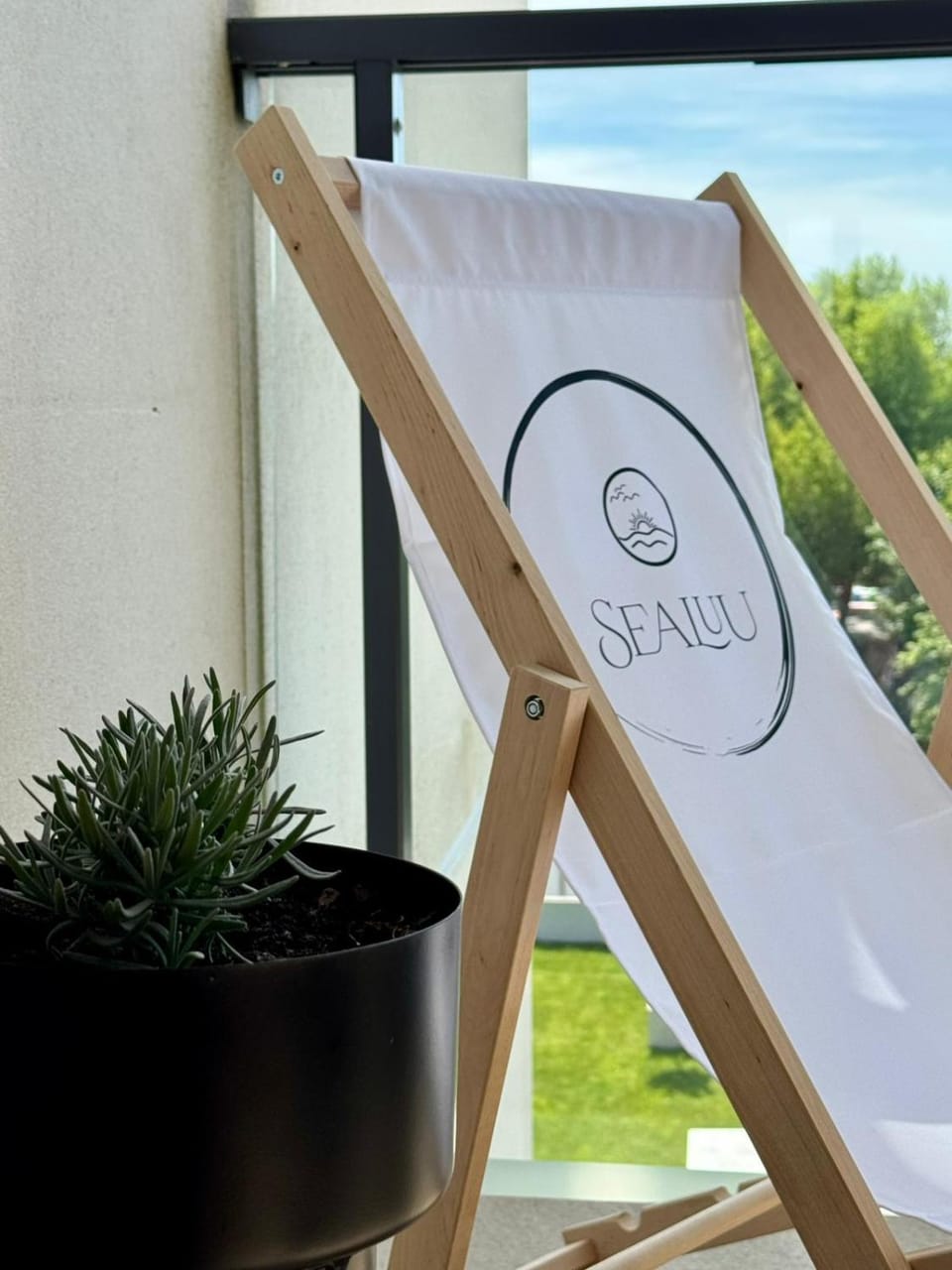 Day, Property logo or sign, sunbed