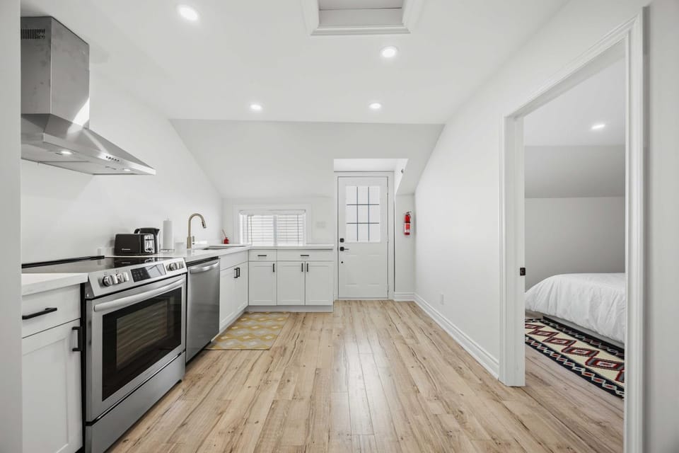 Kitchen or kitchenette, dishwasher, oven, stove, toaster