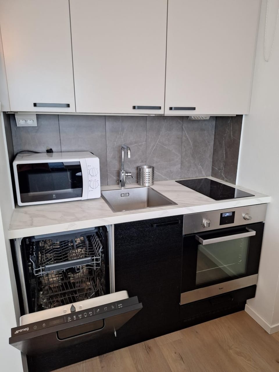 Kitchen or kitchenette, dishwasher, oven, stove