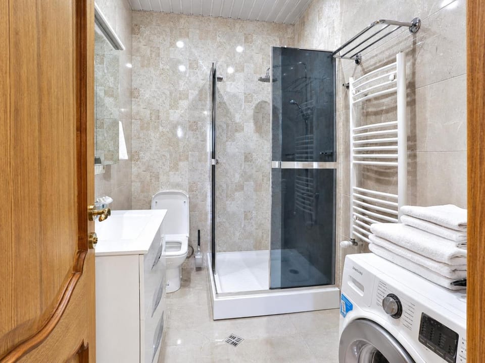 Shower, Toilet, Bathroom, towels, washing machine, dryer