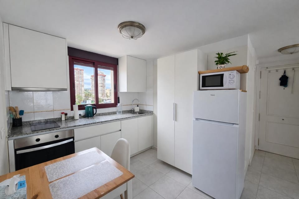 Dining area, microwave, stove, kitchen