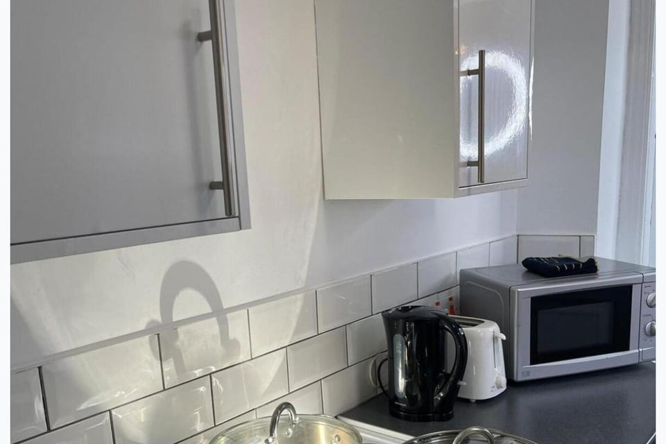 Kitchen or kitchenette, microwave, stove, toaster