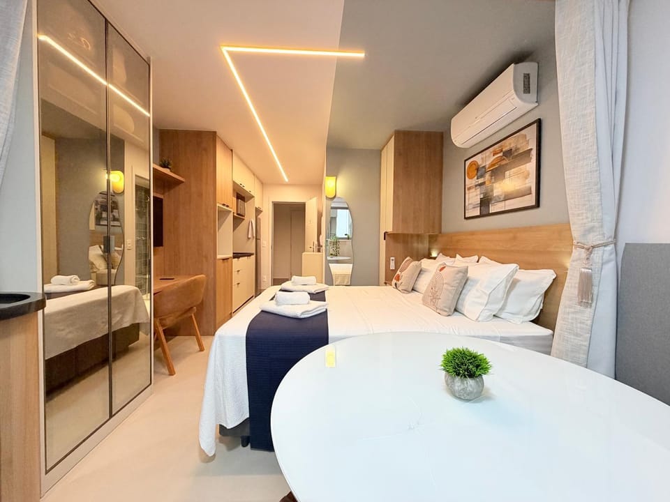 Photo of the whole room, towels, wardrobe, air conditioner