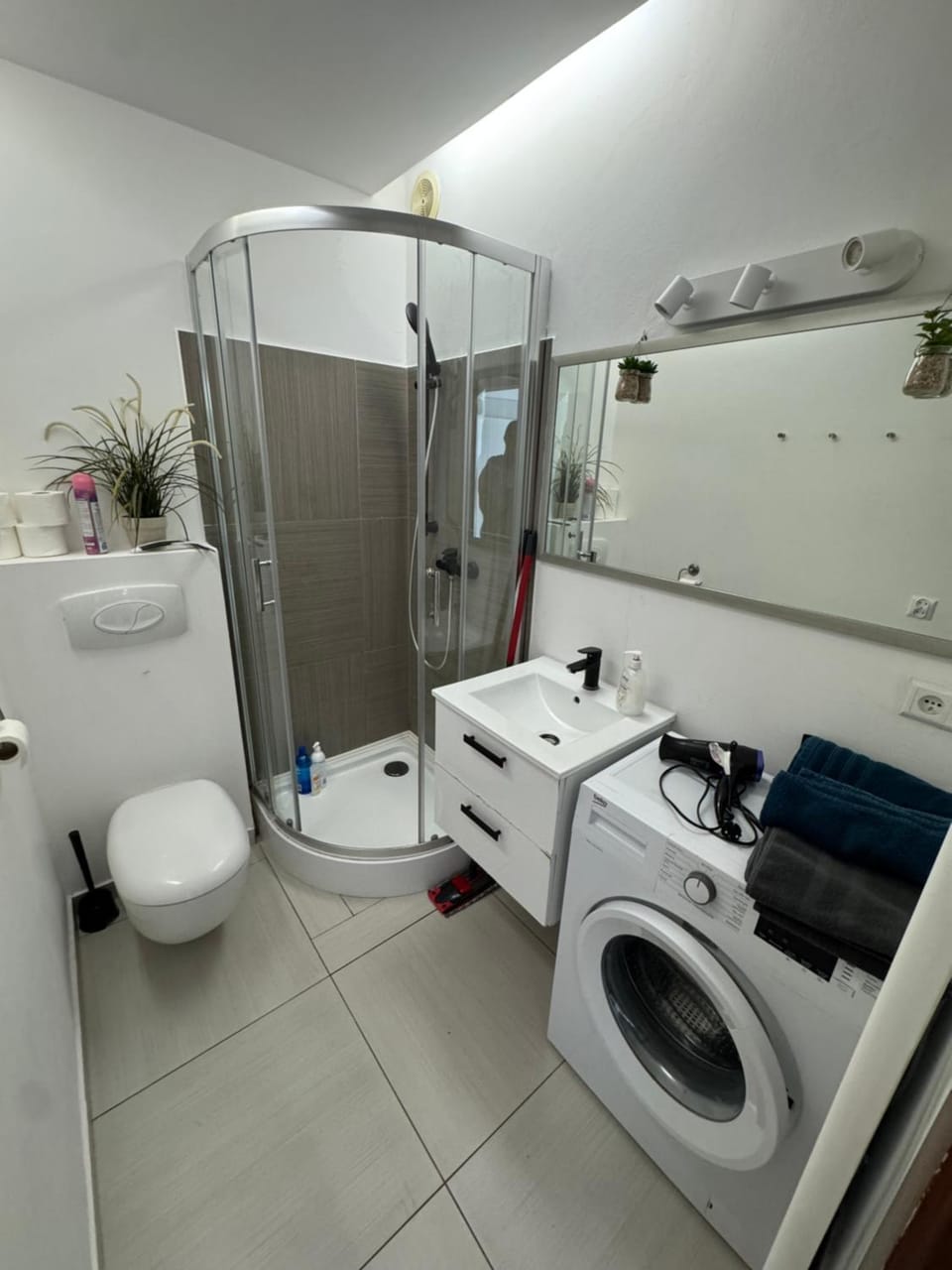 Shower, Toilet, Bathroom, towels, washing machine, dryer