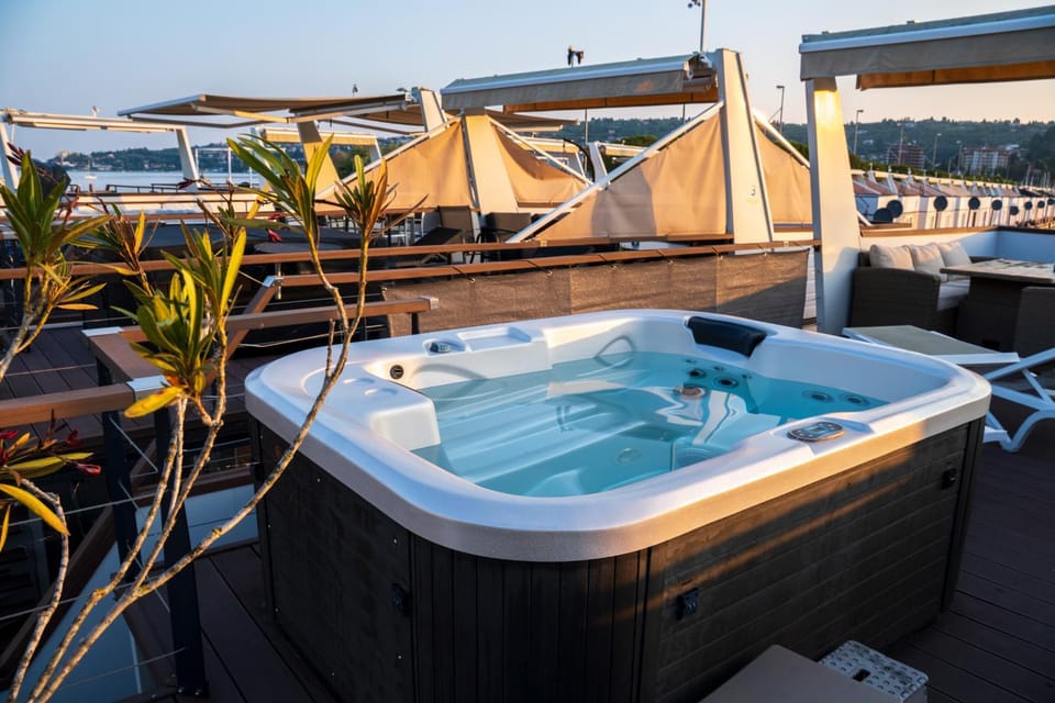 Sirena Lux Seahouse in Marina Portorož, Beachfront with Terrace and Jacuzzi Docked boat in Istria County