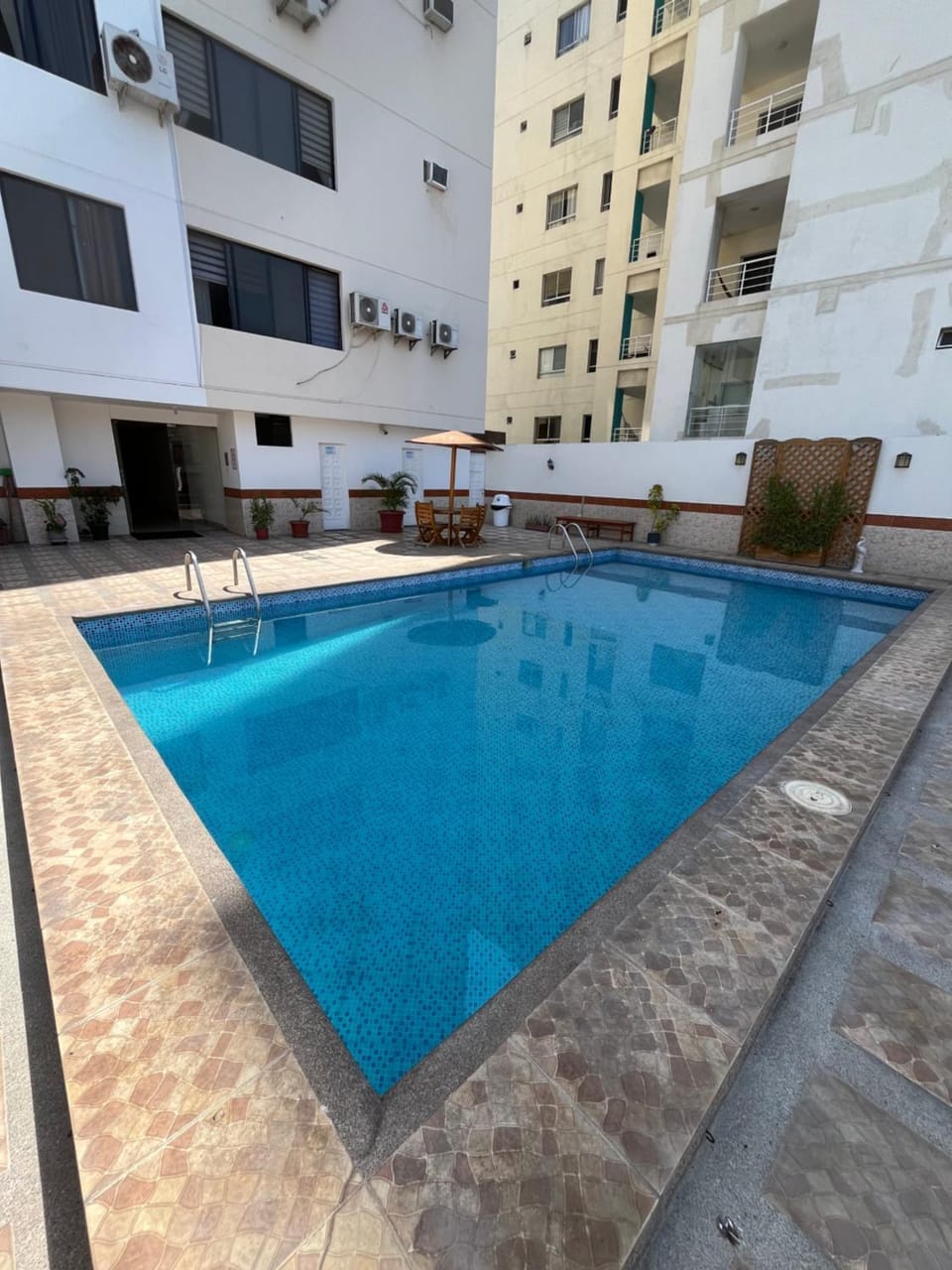Property building, Pool view, Swimming pool, sunbed