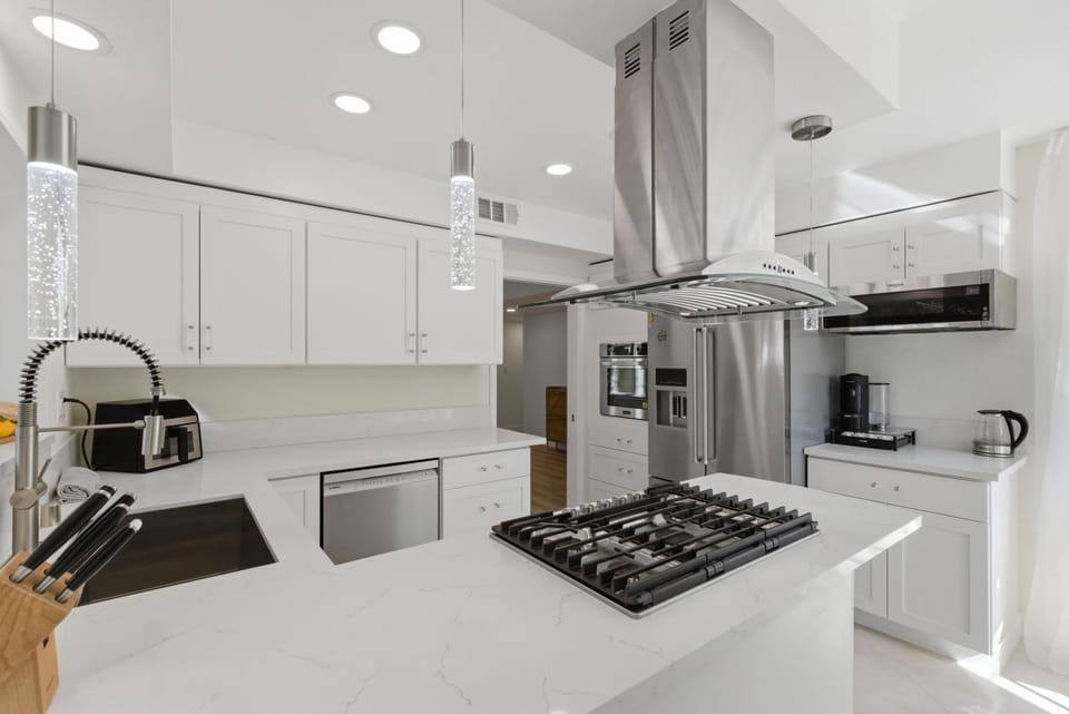 Kitchen or kitchenette, dishwasher, oven, stove