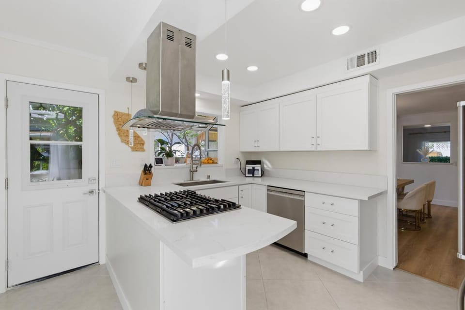 Kitchen or kitchenette, dishwasher, oven, stove