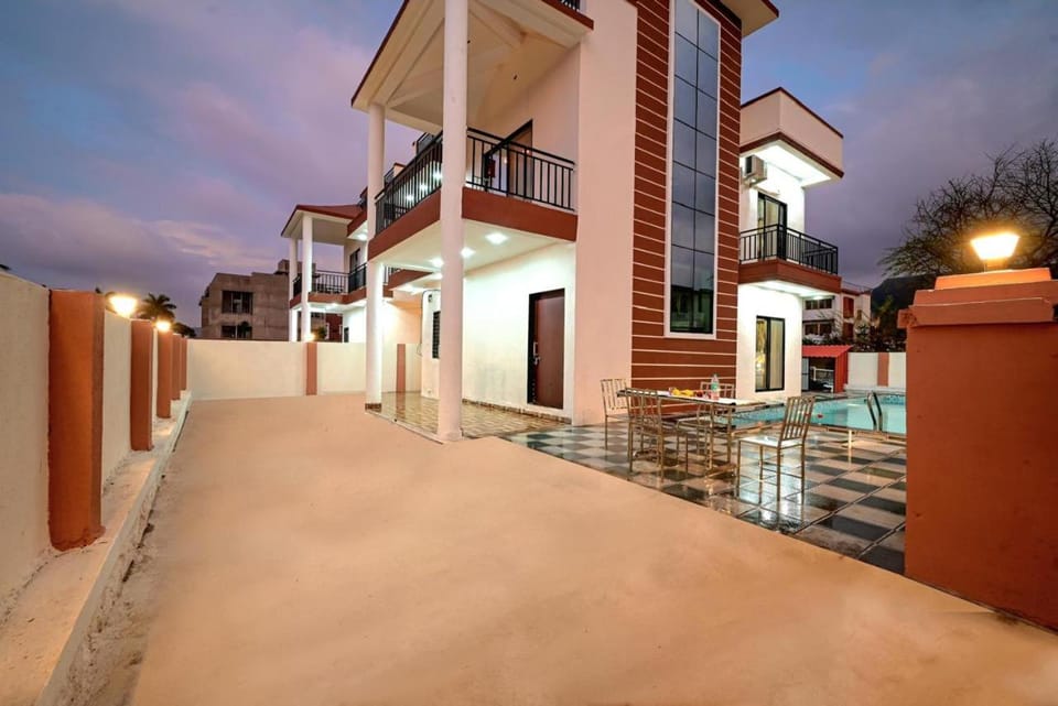 Property building, Patio, Day, Night, View (from property/room), Balcony/Terrace, Pool view, Swimming pool