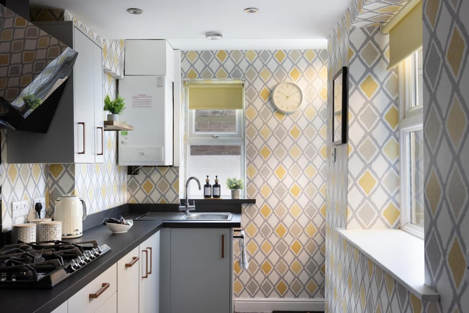 Kitchen or kitchenette, dishwasher, oven, stove