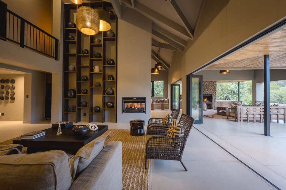 View (from property/room), Living room, Decorative detail, Seating area, Garden view, fireplace
