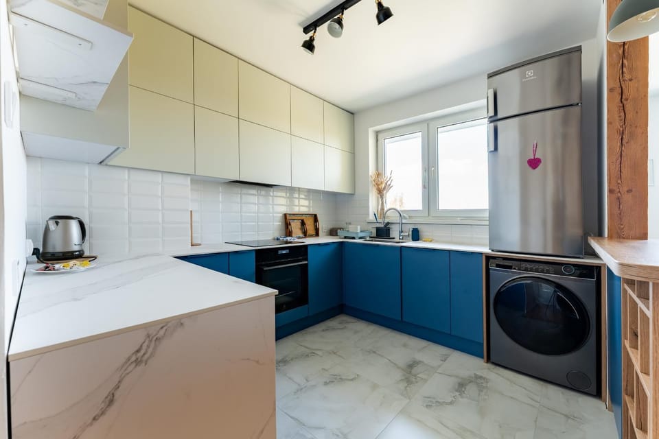 Kitchen or kitchenette, oven, stove, washing machine