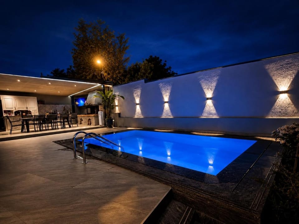 Patio, Night, Pool view, Swimming pool, sunbed