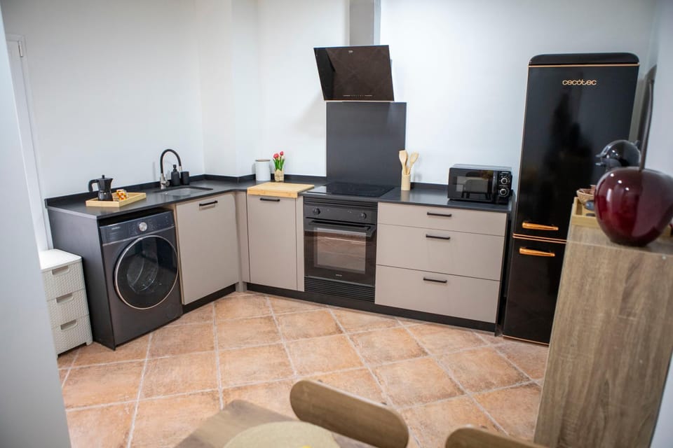 Kitchen or kitchenette, oven, stove, toaster, washing machine, kitchen