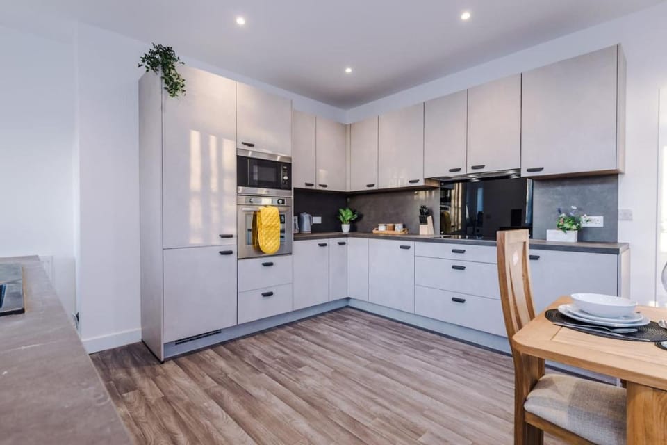 Kitchen or kitchenette, heating, microwave, oven, stove, toaster