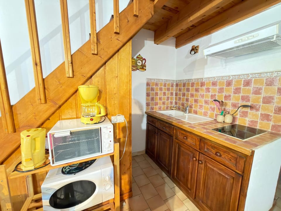 Kitchen or kitchenette, stove, toaster