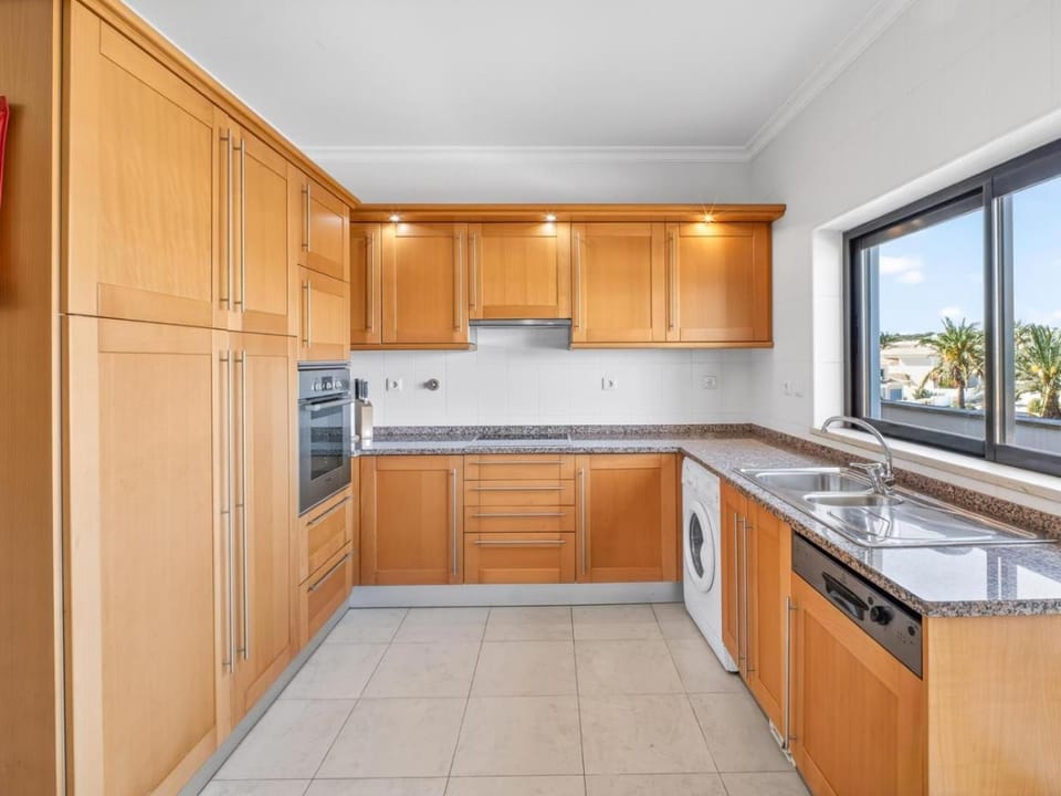 Kitchen or kitchenette, dishwasher, oven, stove