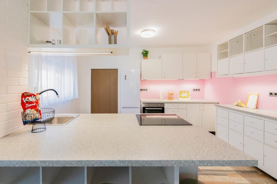 Kitchen or kitchenette, dishwasher, oven, stove