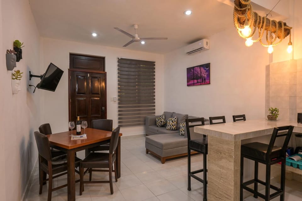 TV and multimedia, Kitchen or kitchenette, Living room, Photo of the whole room, Seating area, Dining area, air conditioner