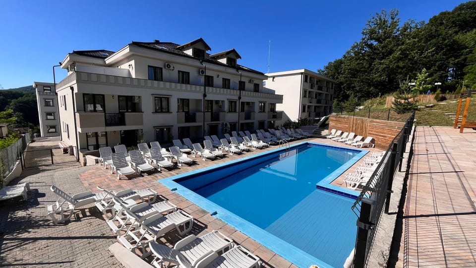 Property building, Day, Natural landscape, Pool view, Swimming pool, Swimming pool, sunbed